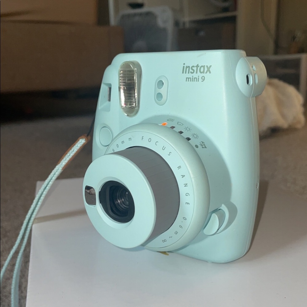 Teal polaroid camera